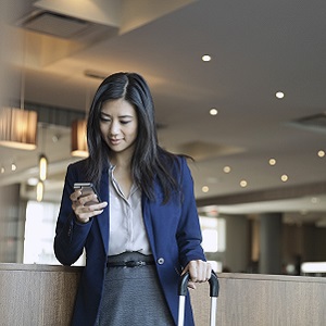 Image of lady checking into a hotel